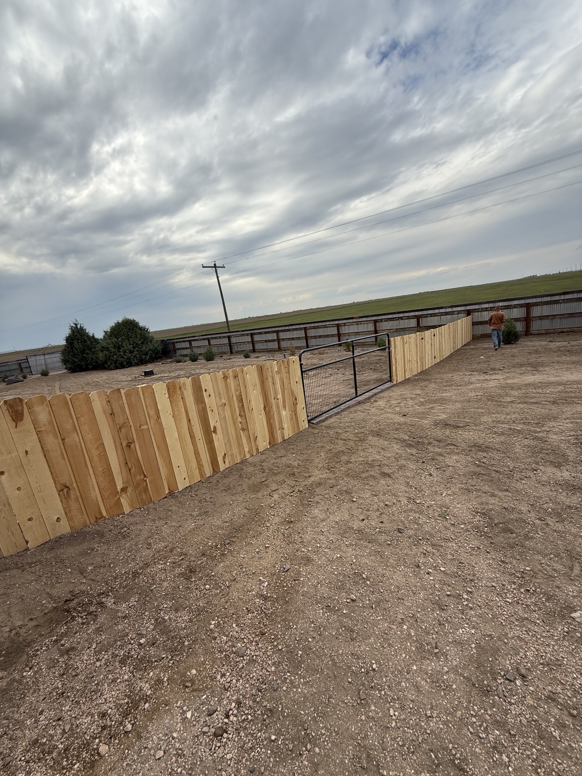 Cedar fence along the side of a residential yard