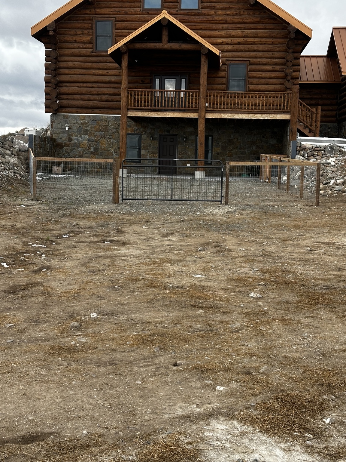 Completed rural fence enclosure and gravel area