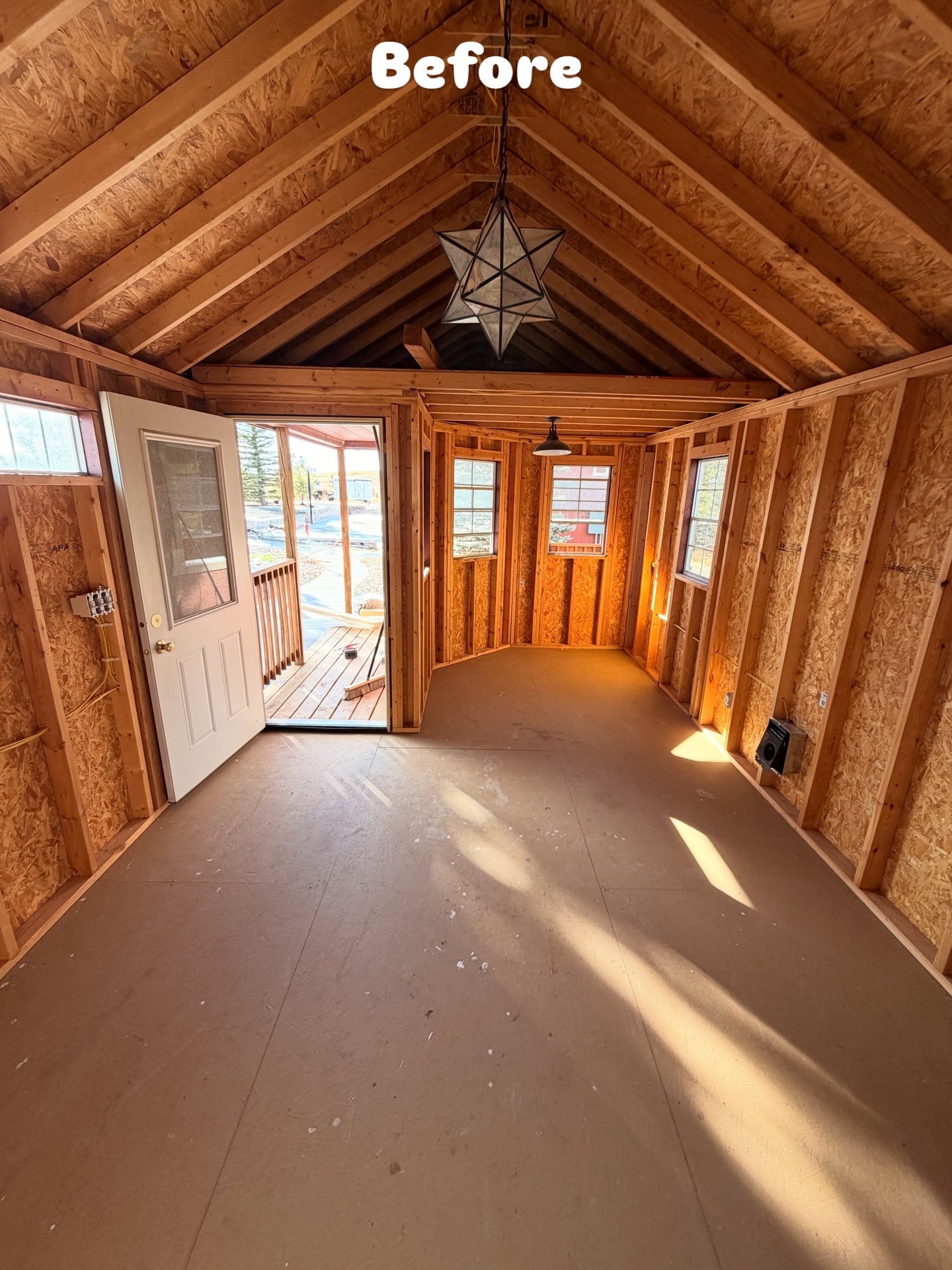 Second view of unfinished shed interior before improvements
